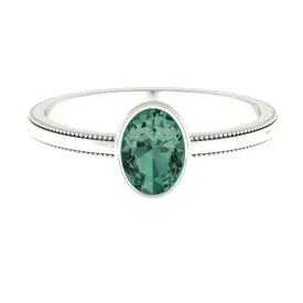 Bezel Set Oval Green Sapphire Solitaire Ring with Beaded Detailing