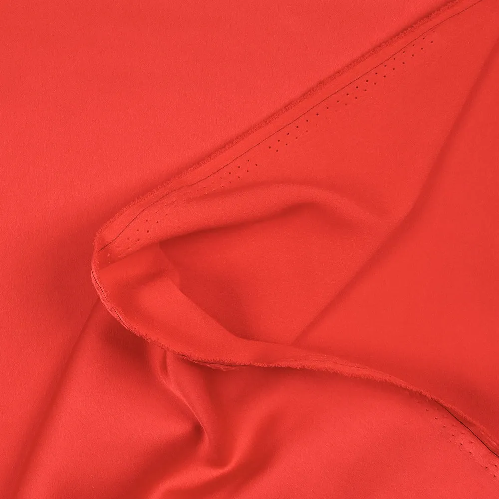 Crêpe satin de polyester uni rouge corail