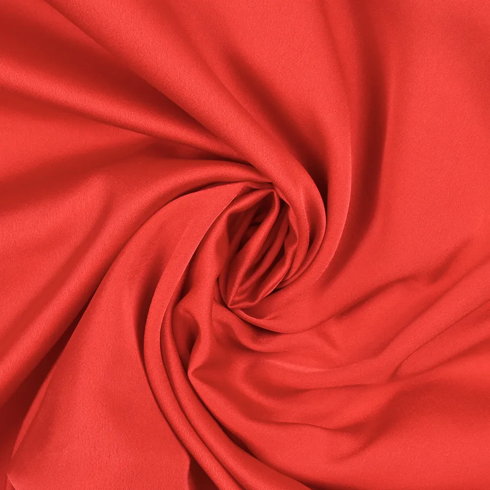 Crêpe satin de polyester uni rouge corail