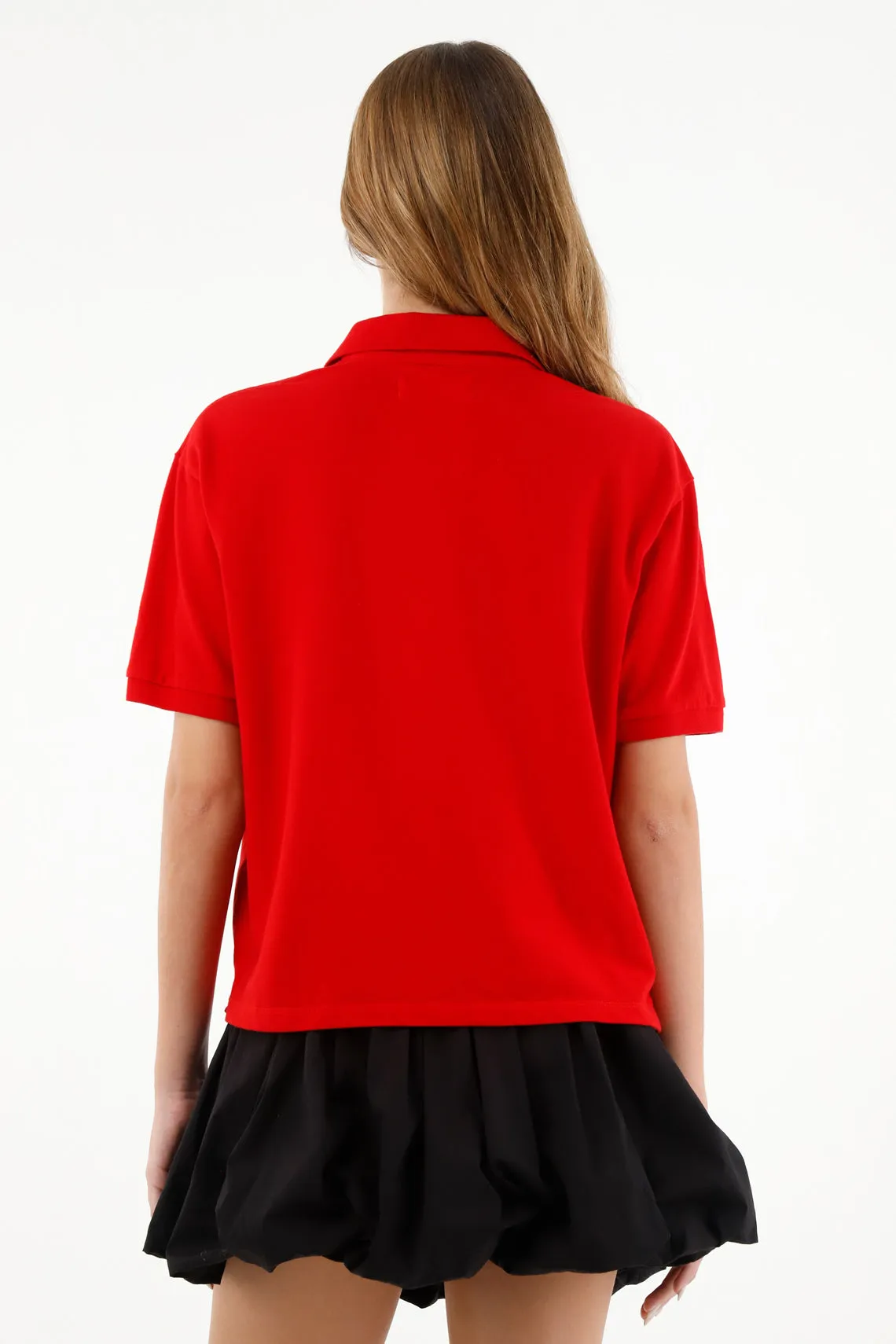 Polo roja con raqueta bordada para mujer