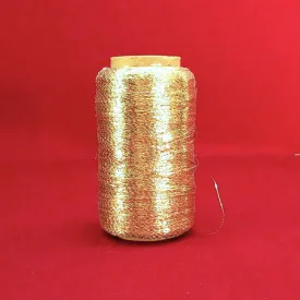 Used Spool of Gold Yarn on Spindle